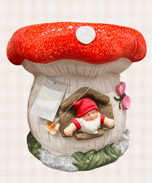 cute toadstool with garden gnome peeking out window