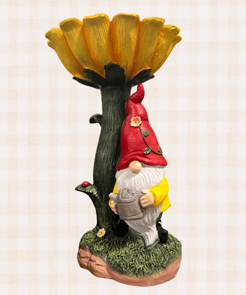 Yellow flower bee feeder with a cute garden gnome at the base from HomeGoods