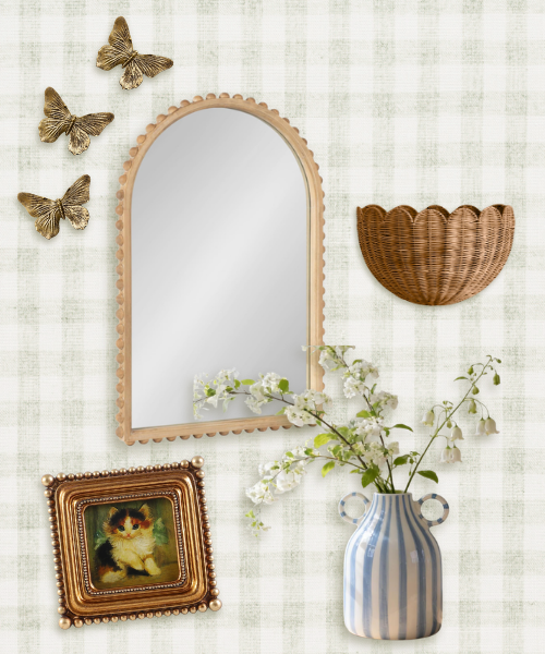 Nancy Meyers inspired eclectic home decor featuring brass butterflies, scalloped mirror, woven basket, striped vase, and vintage-style gold frame